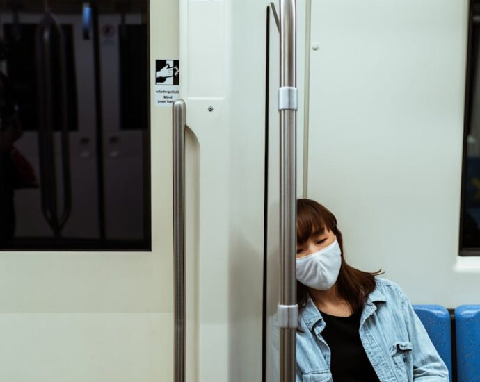 Woman Wearing a Face Mask on the Subway