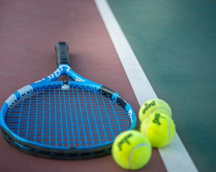 yellow and blue tennis racket